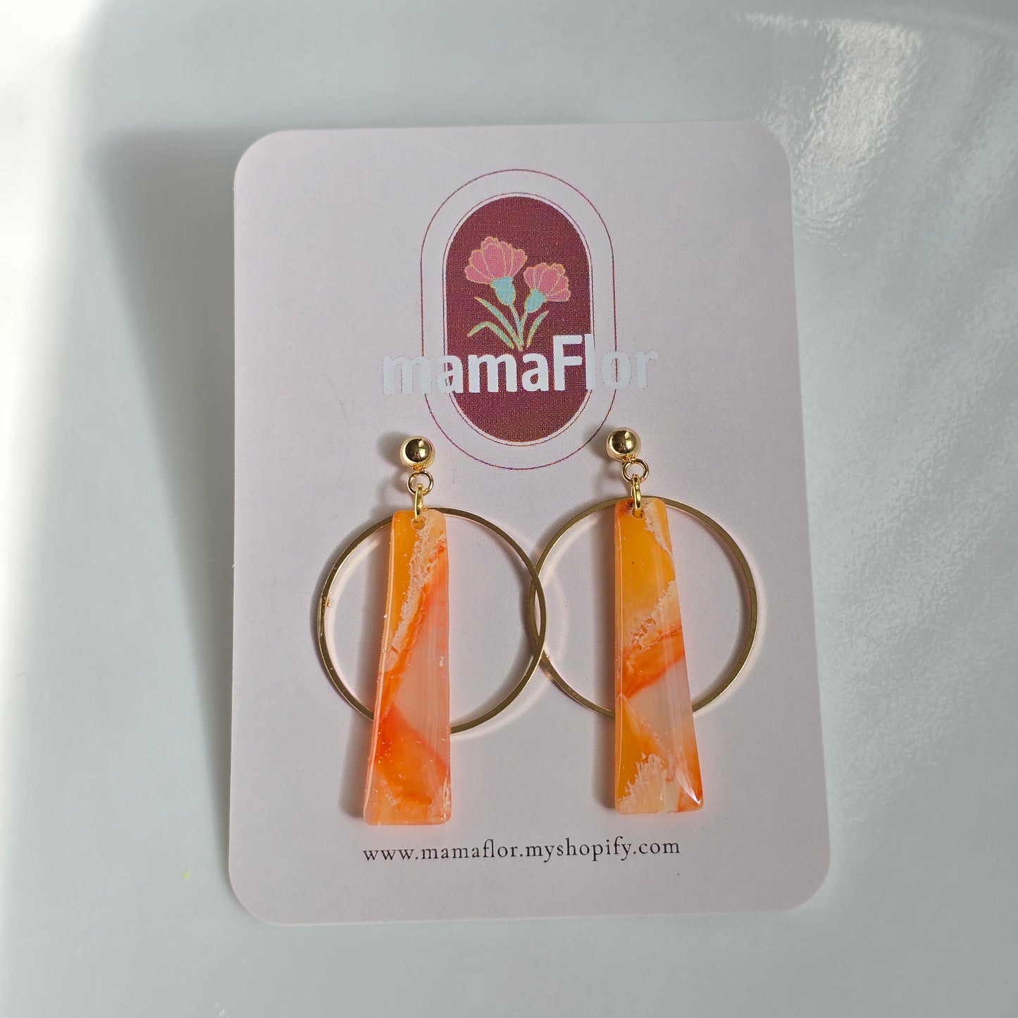 Petra Halo Dangle Earrings in translucent clementine marbling