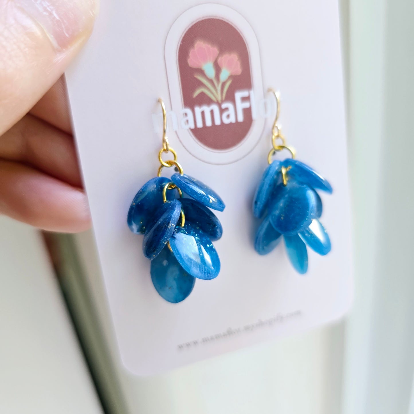 Ada Cascade Earrings in translucent speckled blue