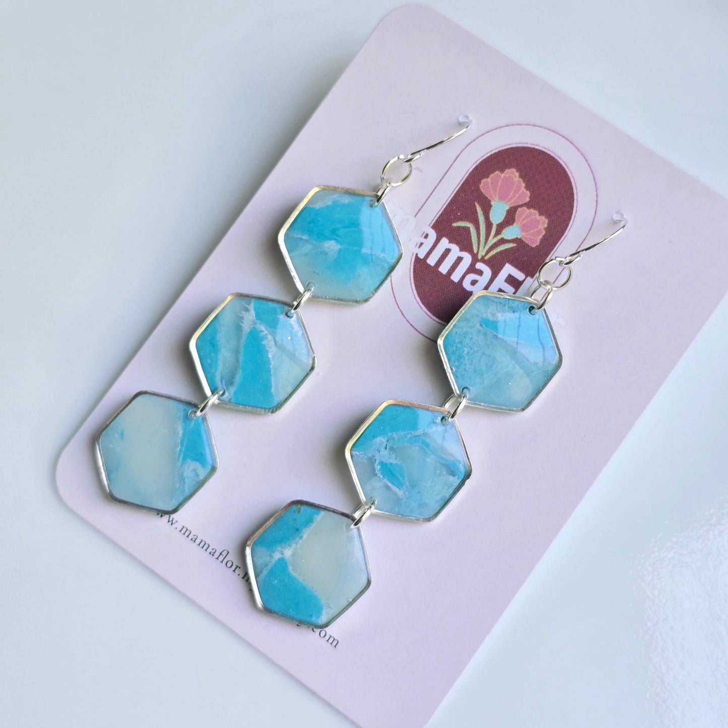 Trés Hex Hook Earrings in translucent sky blue marbling