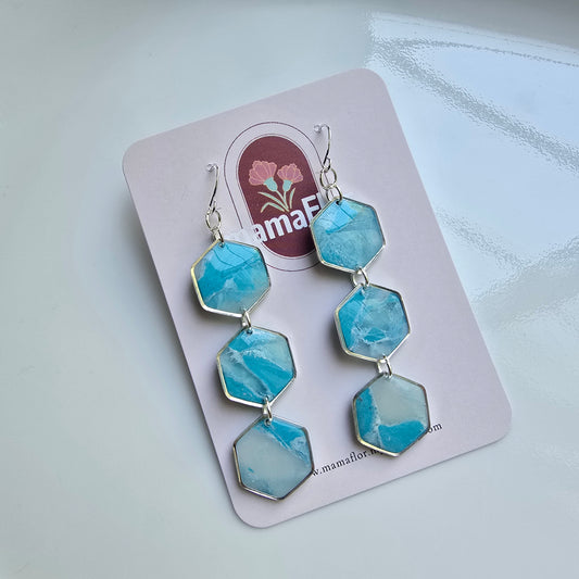 Trés Hex Hook Earrings in translucent sky blue marbling
